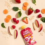 Three Robins Super Berry Little Smoothie pouch surrounded by fruit and veg including apple, raspberry, carrot, spinach and strawberries and oats