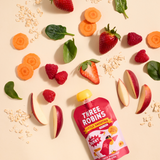 Three Robins Super Berry Little Smoothie pouch surrounded by fruit and veg including apple, raspberry, carrot, spinach and strawberries and oats