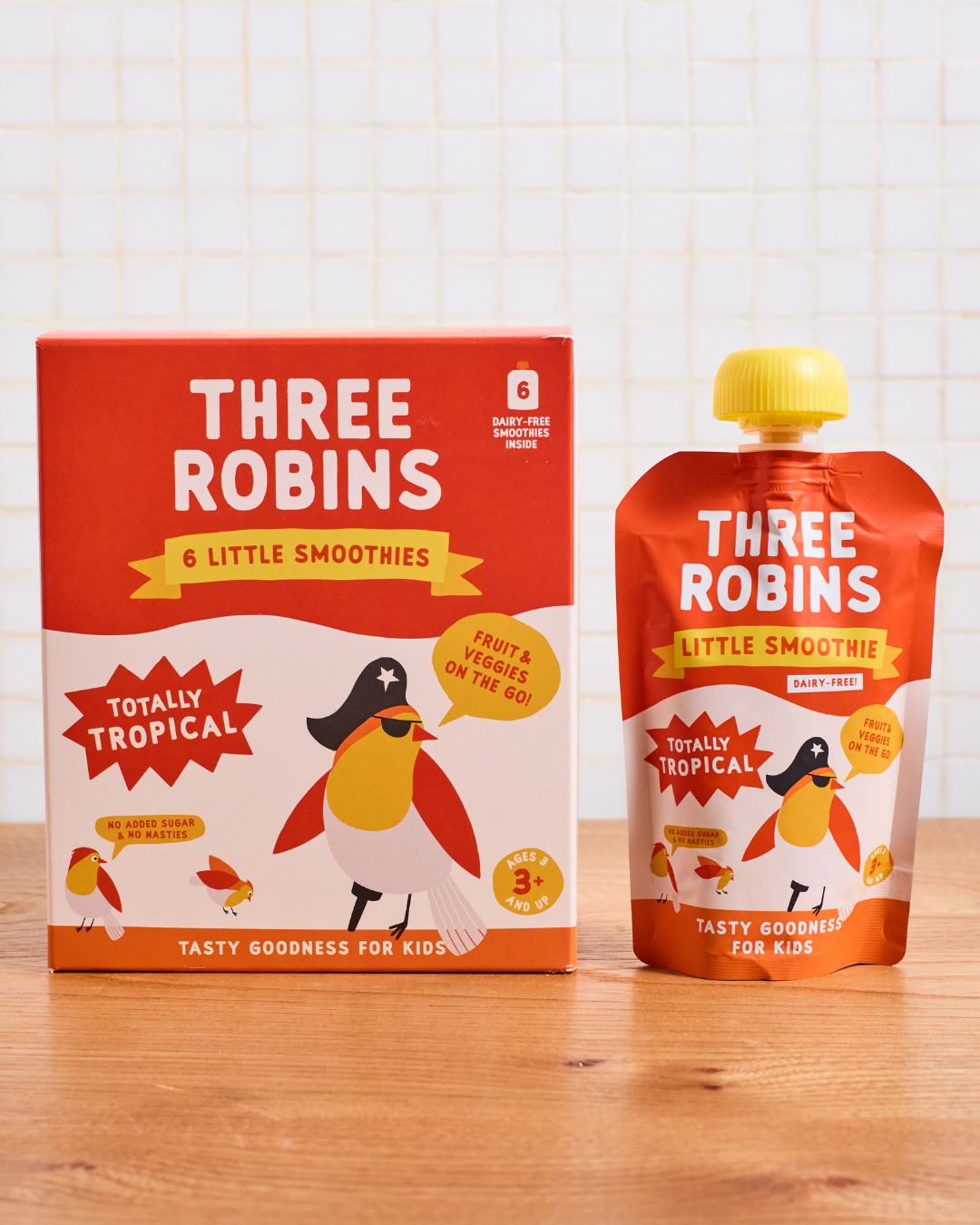Three Robins Totally Tropical Little Smoothie multipack box beside pouch